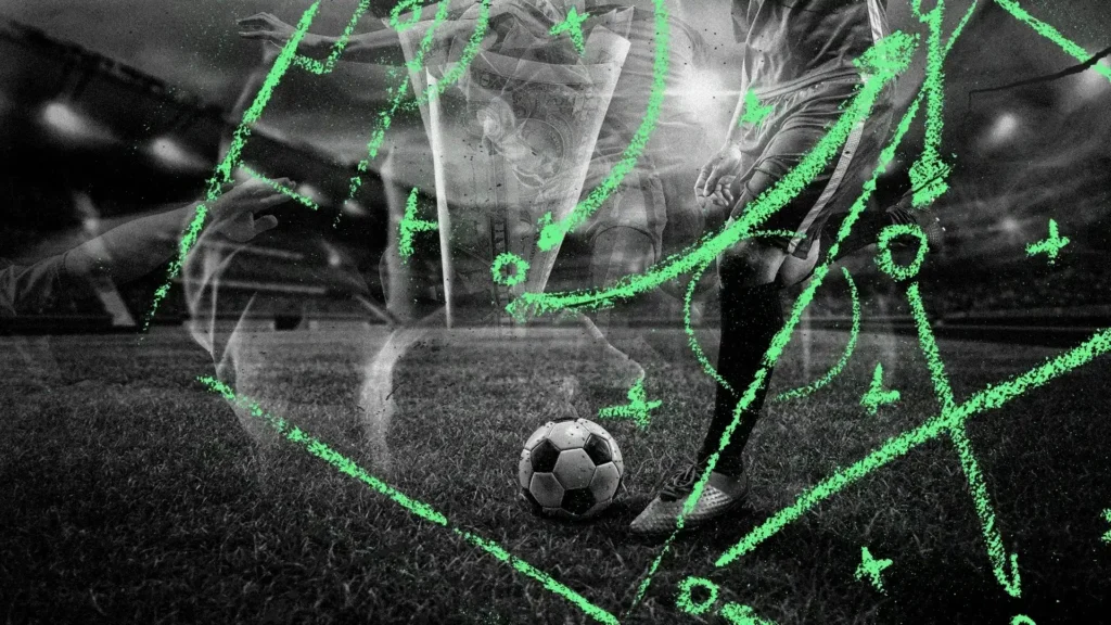 a football player sitting next to a football ball